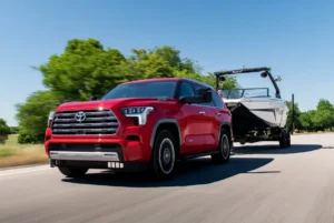 2024 Toyota Sequoia towing a boat image 1