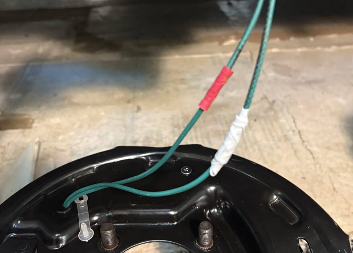 Weather-resistant grey tape around red insulated crimp joint (photo by author) image 7