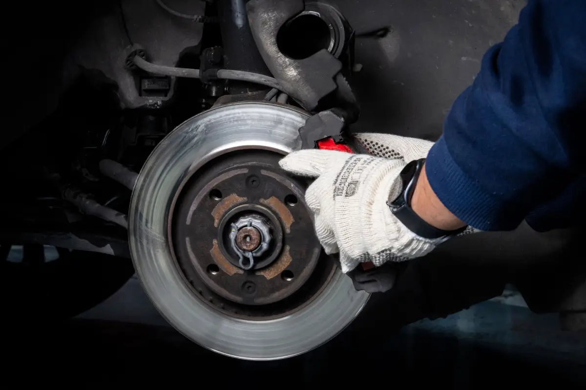 Disassembling the braking assembly to access the wheel hub. Image courtesy of Pexels.