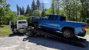 dead gm truck on tow truck
