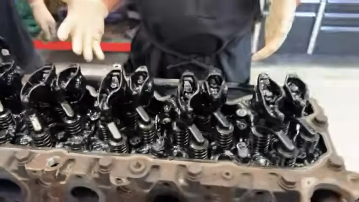 Rocker arm assembly nearing failure. Screen capture from Daves Auto Center / YouTube