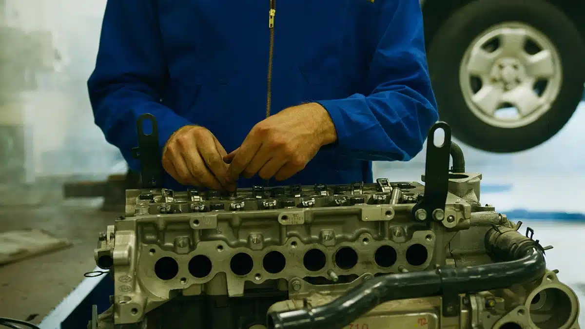 Mechanic inspecting an engine after a major failure