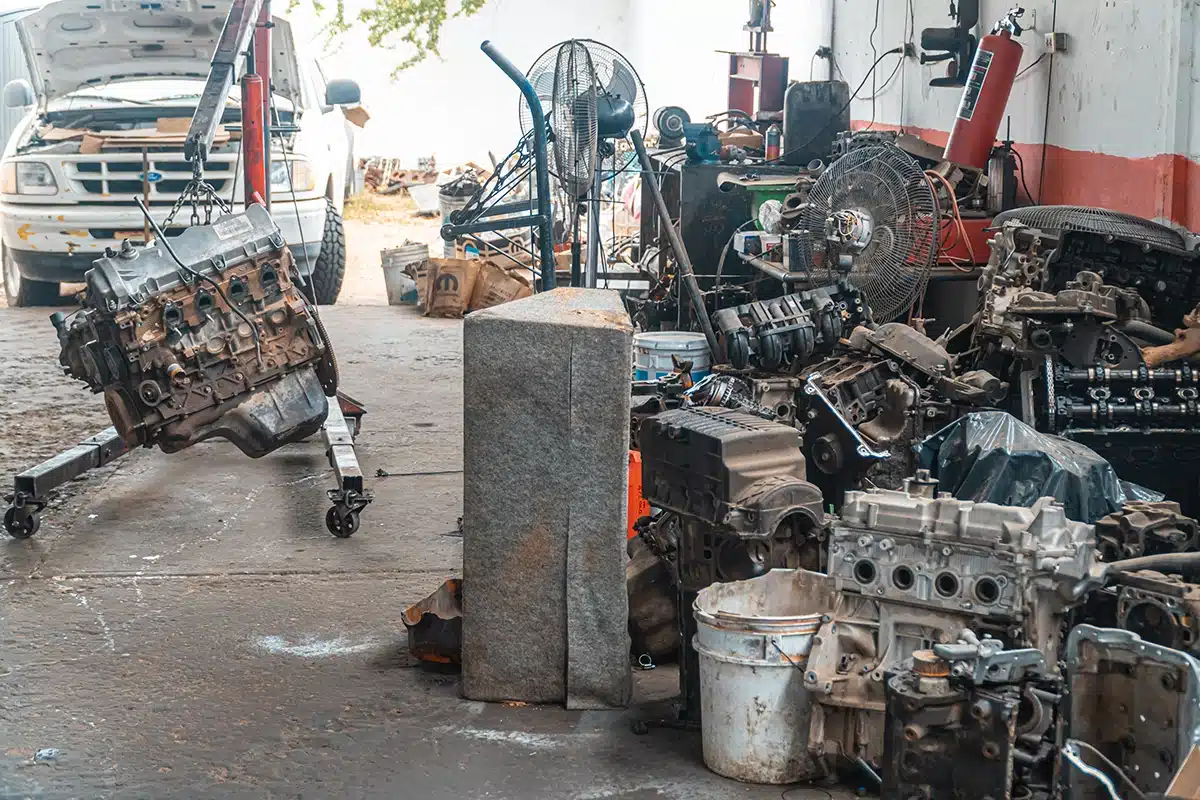 Mechanic working on an engine in a repair shop