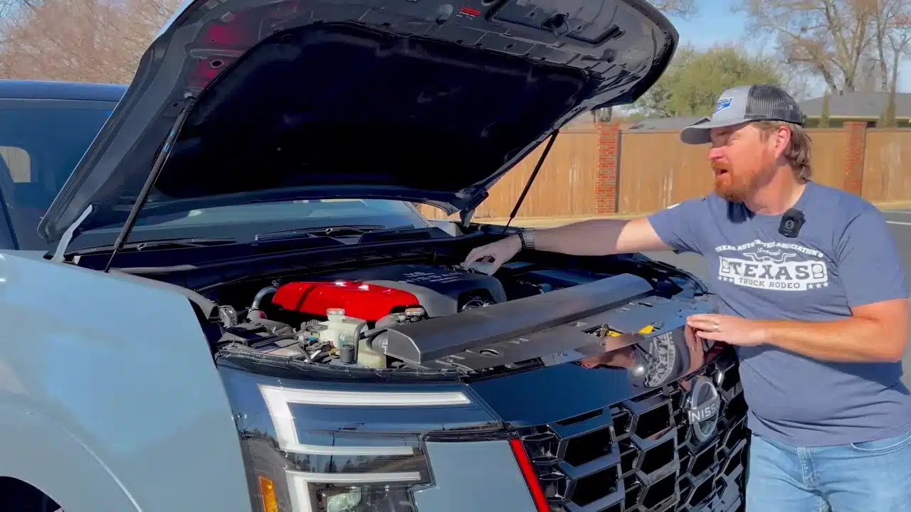 Cory Fourniquet showing the Armada Nismo engine compartment