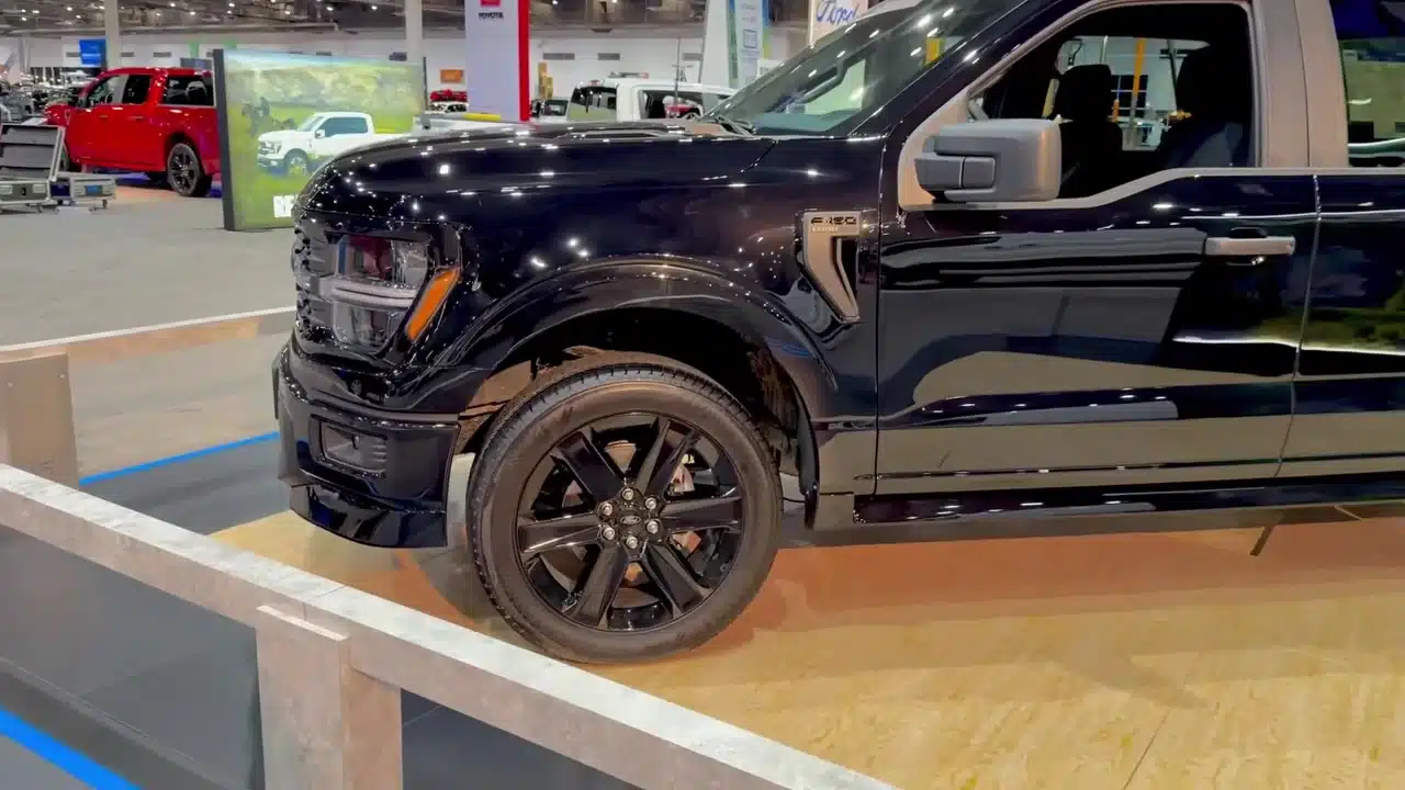 Side view of the Ford F-150 Lobo showing its black 22-inch wheel