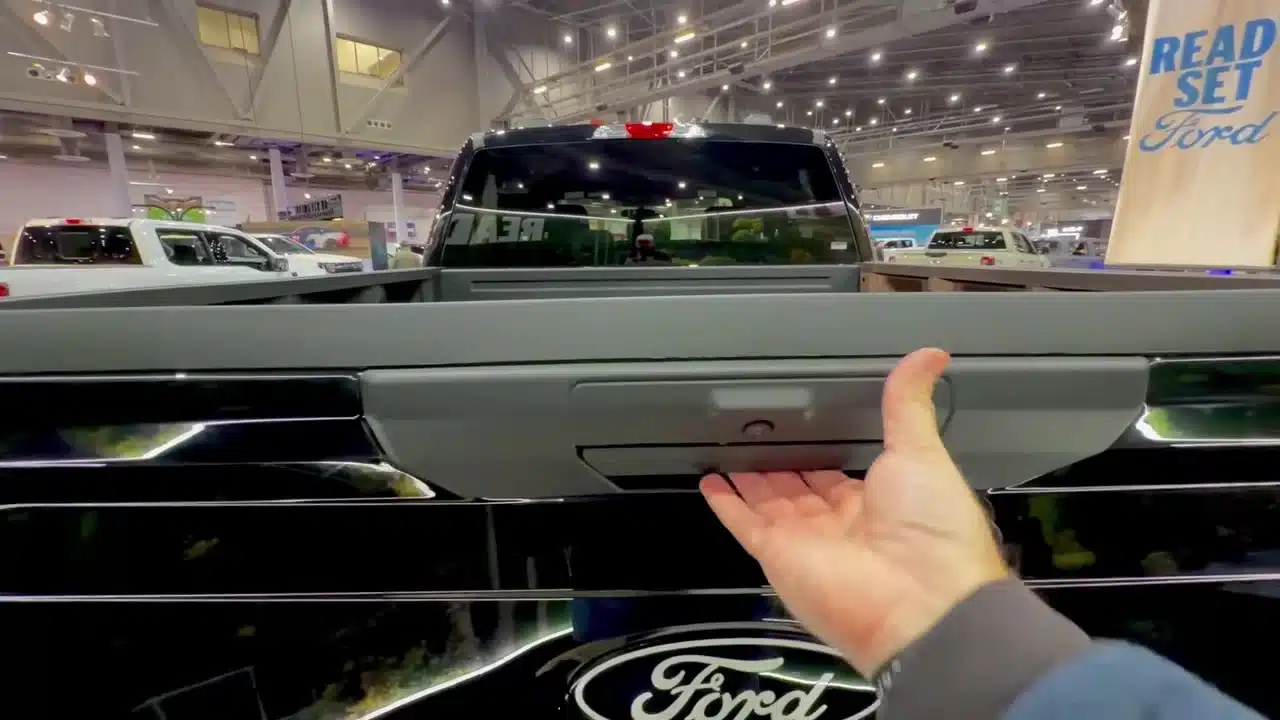 Cory opens the tailgate of the 2026 Ford F-150 Lobo display truck