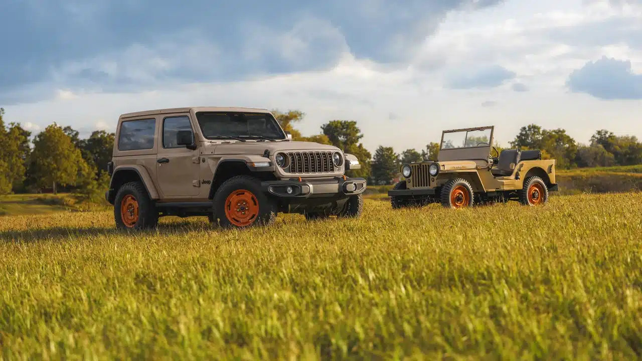 2027 Jeep Wrangler JL-2A in Gobi beside a vintage Willys CJ-2A