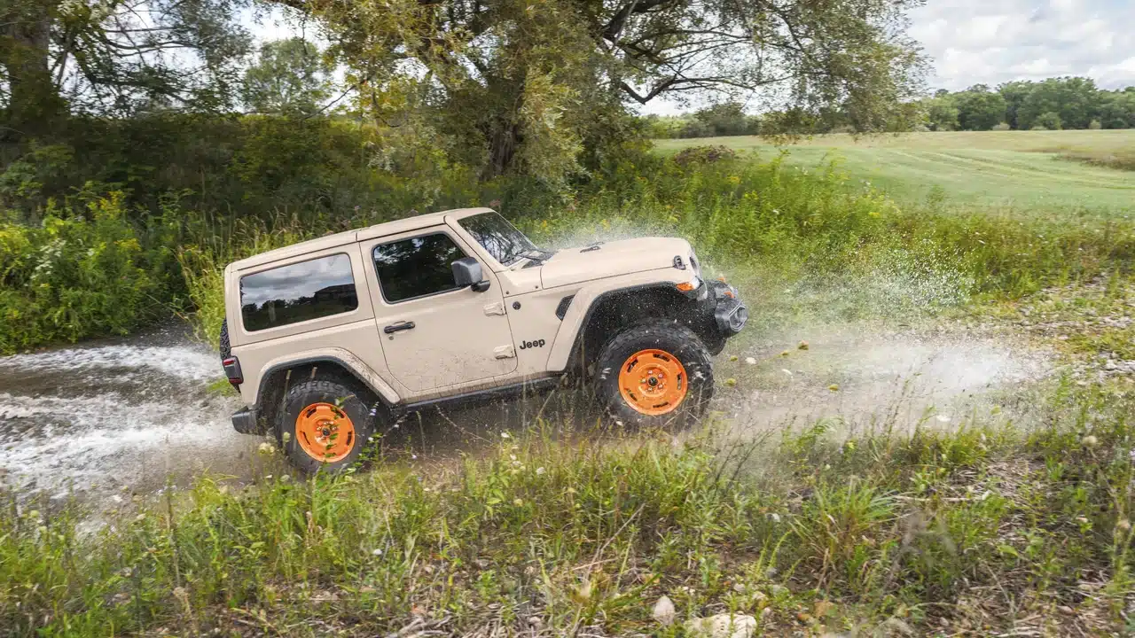 Two-door 2027 Jeep Wrangler JL-2A crossing shallow water