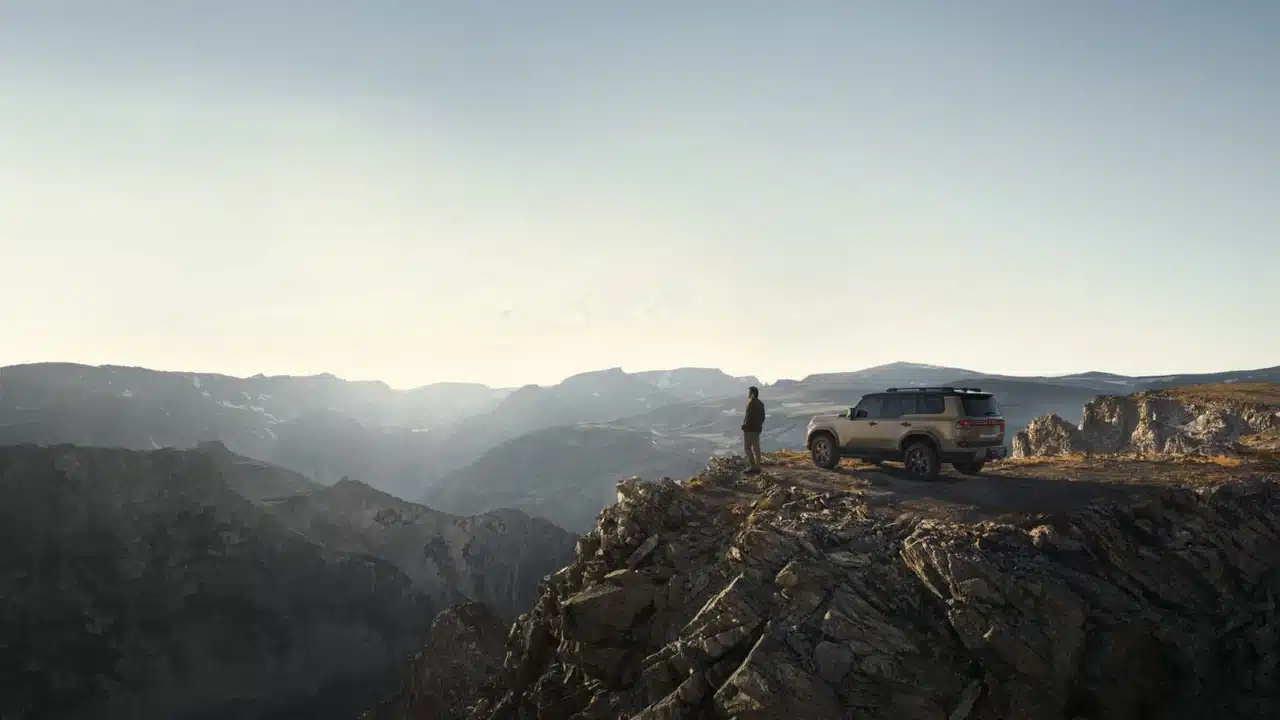 2027 Lexus GX overlooking a mountain landscape