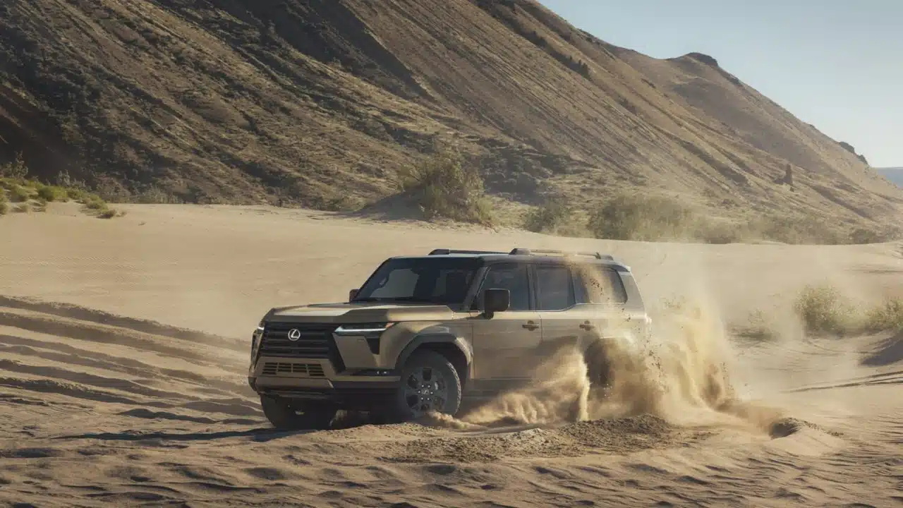 2027 Lexus GX driving through sand
