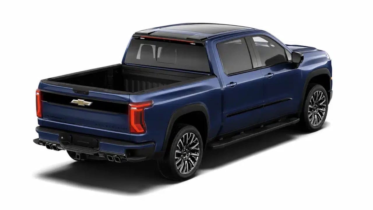 Rear three-quarter view of a blue 2027 Chevrolet Silverado 1500 High Country