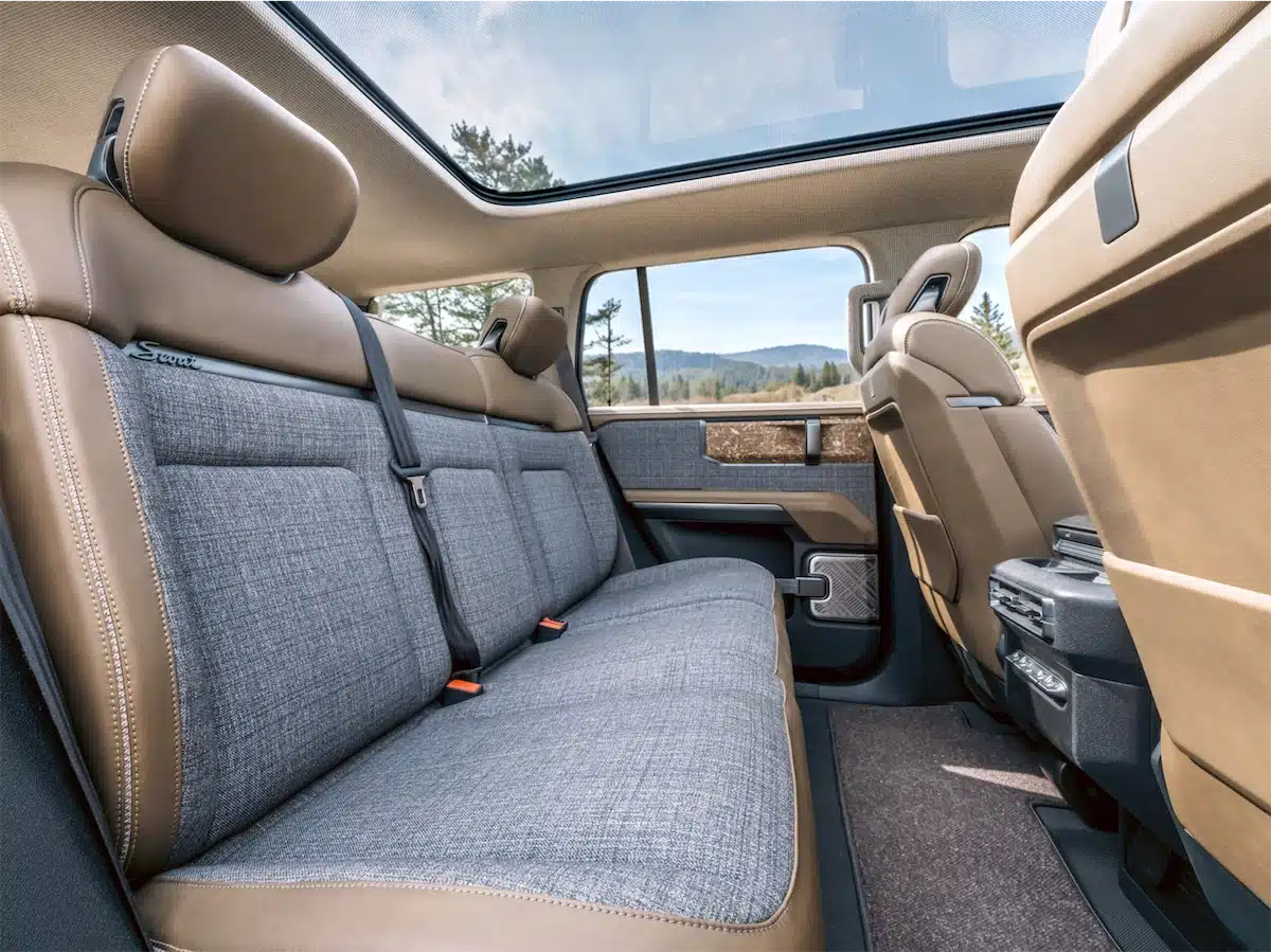 Interior of the Scout Traveler Mountainside concept showing semi-aniline leather, recycled walnut trim, and houndstooth headliner