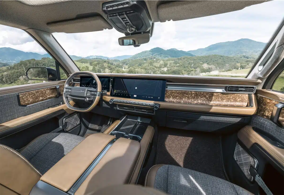 Interior of the Scout Traveler Mountainside concept showing semi-aniline leather, recycled walnut trim, and houndstooth headliner