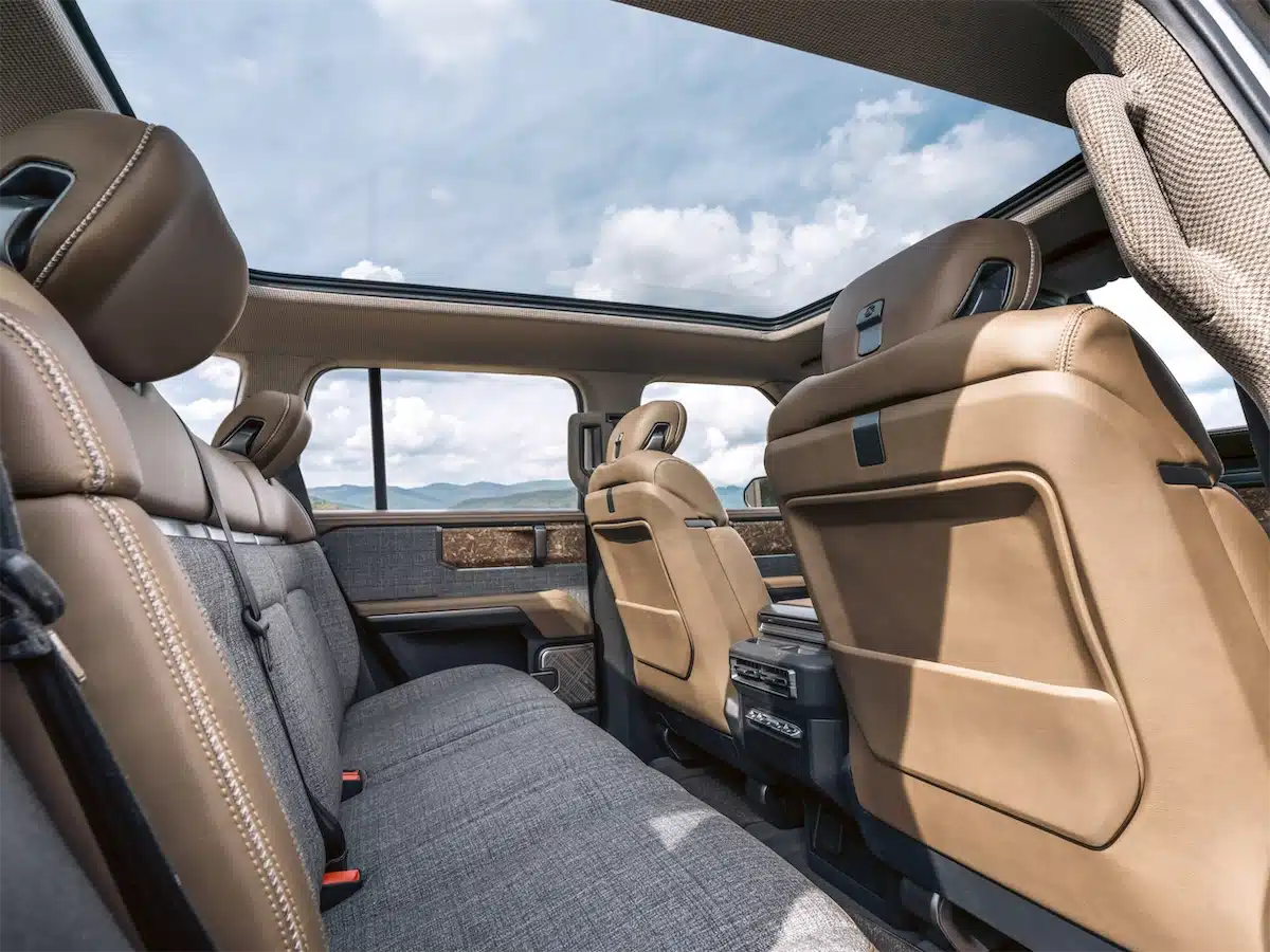 Interior of the Scout Traveler Mountainside concept showing semi-aniline leather, recycled walnut trim, and houndstooth headliner