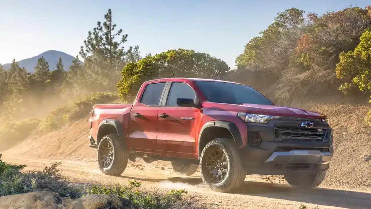 Red Chevrolet Colorado Trail Boss on a dirt road
