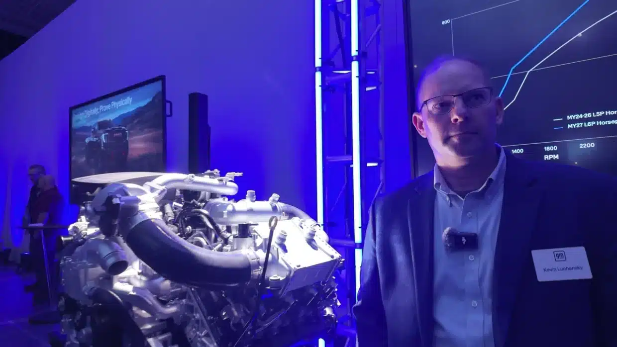 GM’s new 8.3-liter Duramax on display with an engineer at the powertrain event.