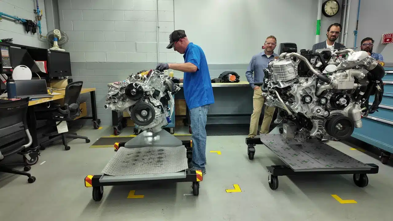GM technician working on engine assembly