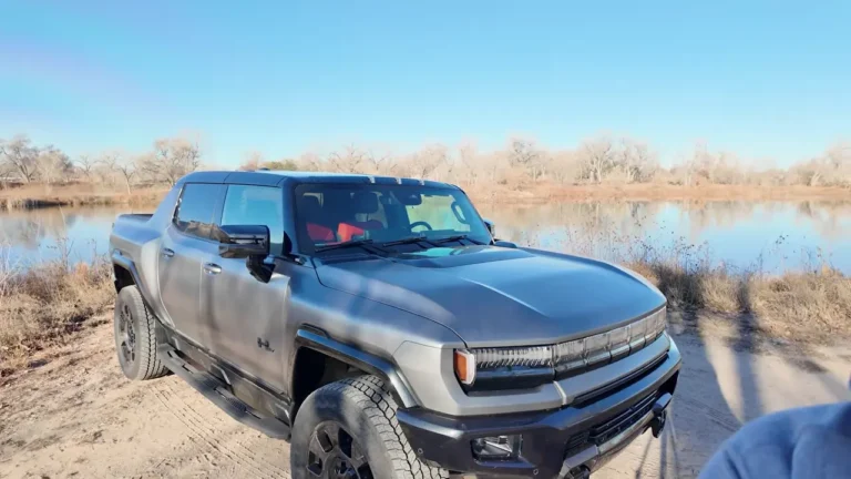 2026 GMC Hummer EV Carbon Fiber Edition in Magnus Gray Matte beside a lake