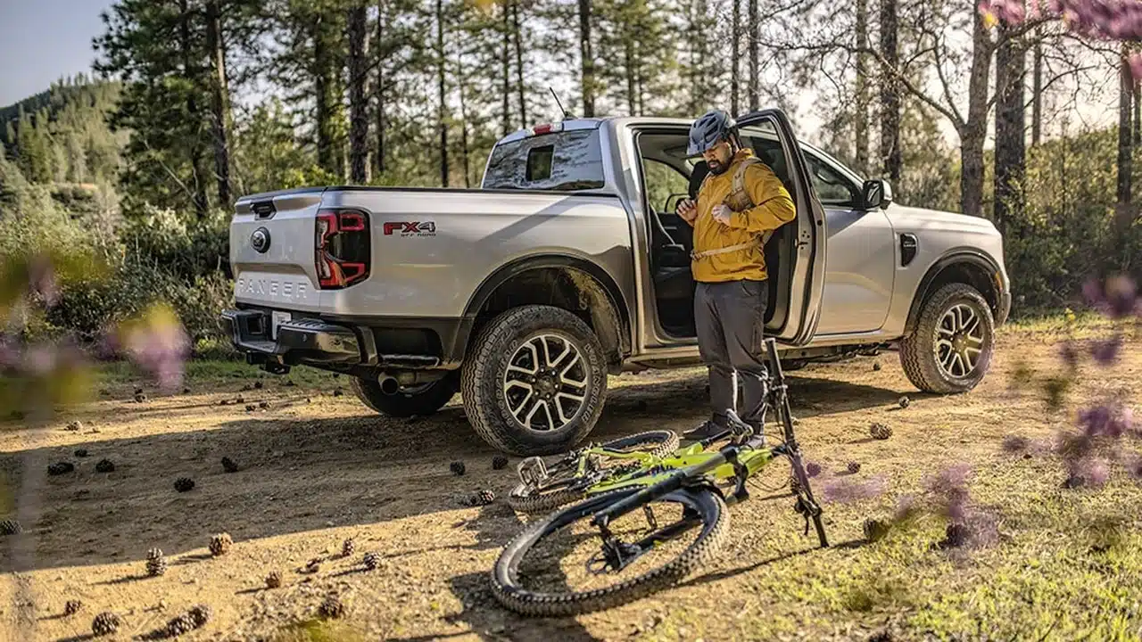 Ford Ranger Lariat parked beside a trail