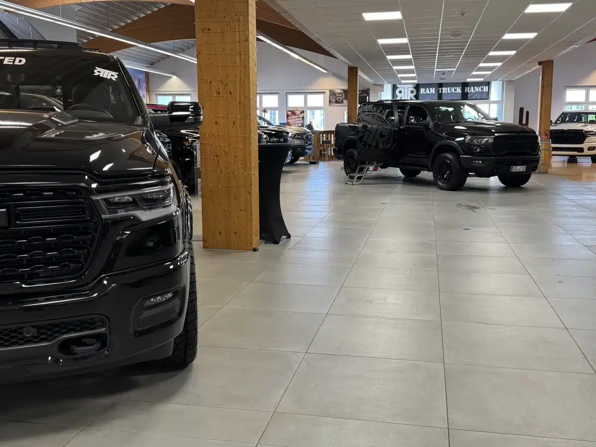 Ram pickups displayed along the RTR showroom floor.