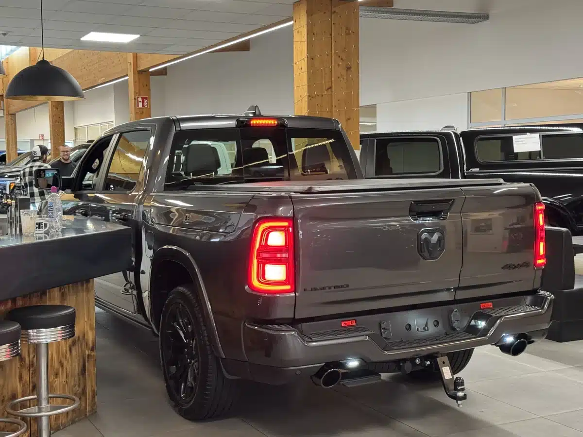 Rear view of a Ram pickup inside the showroom.