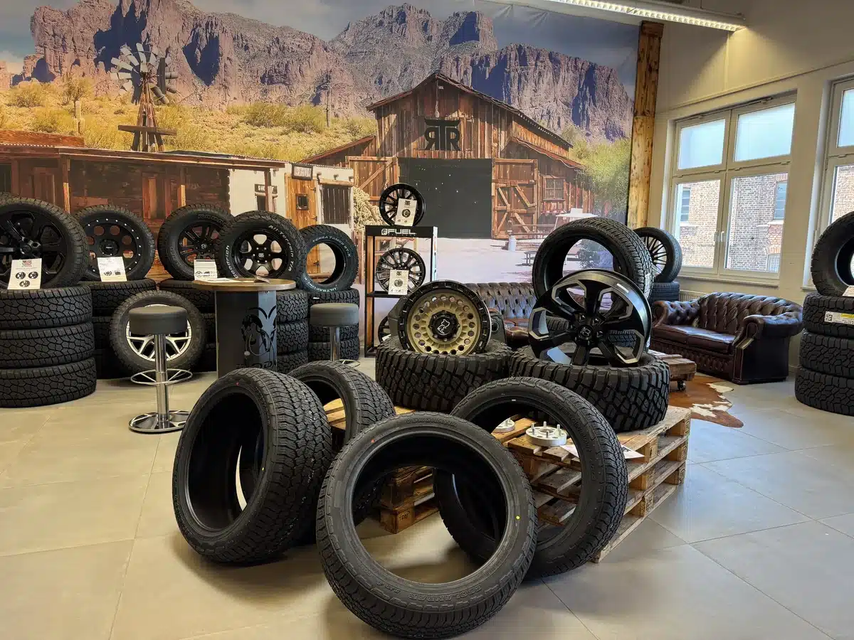 Wheels and tires displayed in front of an American Southwest mural at RTR Ram Truck Ranch.