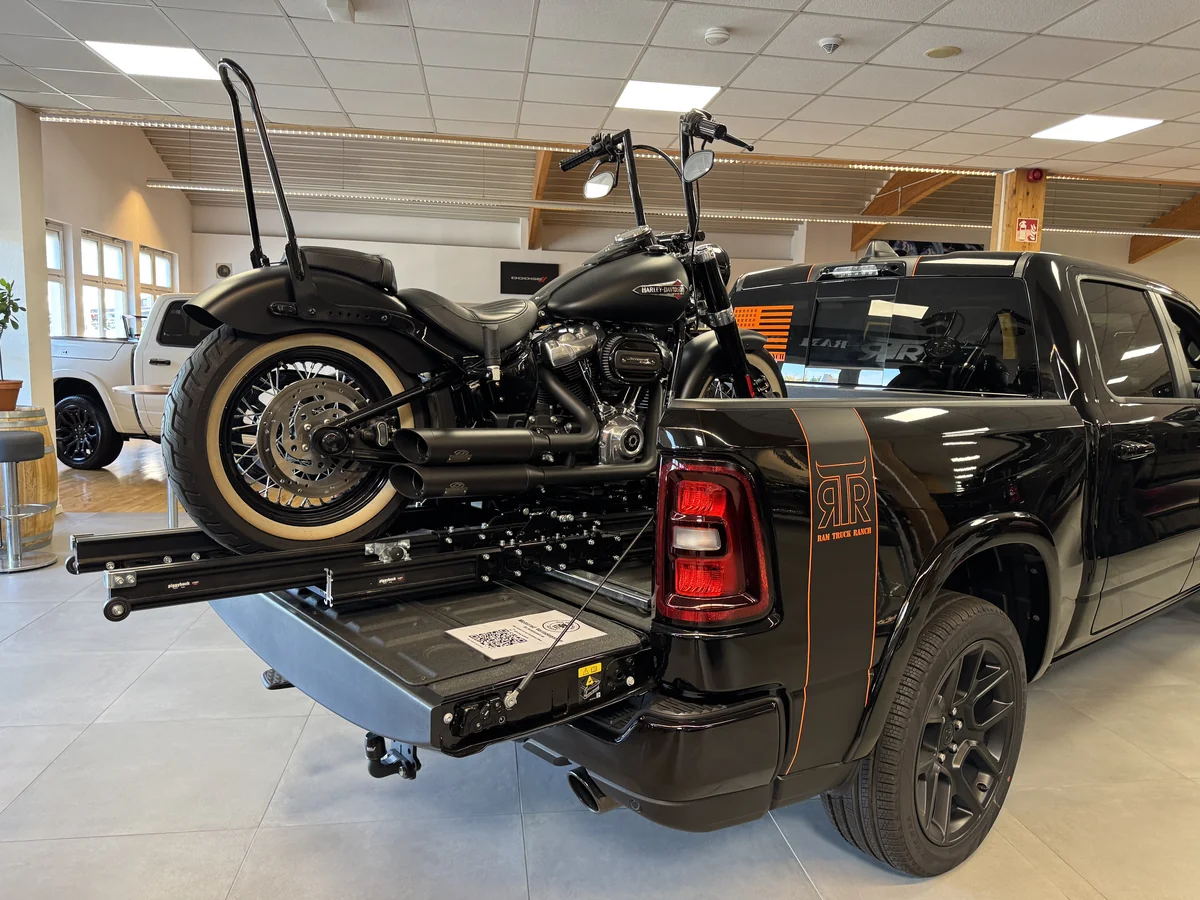 Harley-Davidson motorcycle displayed in the bed of a Ram pickup at RTR Ram Truck Ranch.