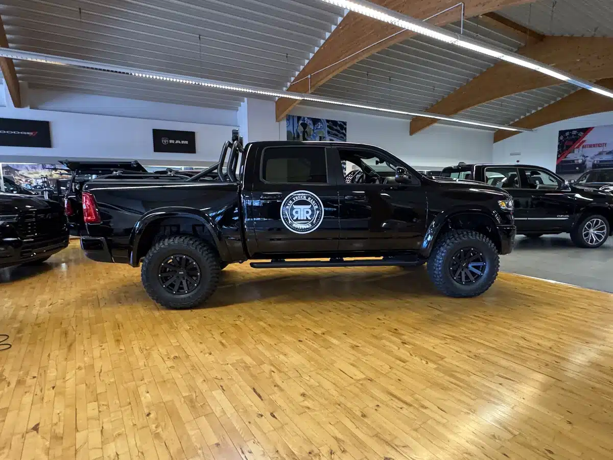 Side view of a customized Ram pickup inside RTR.