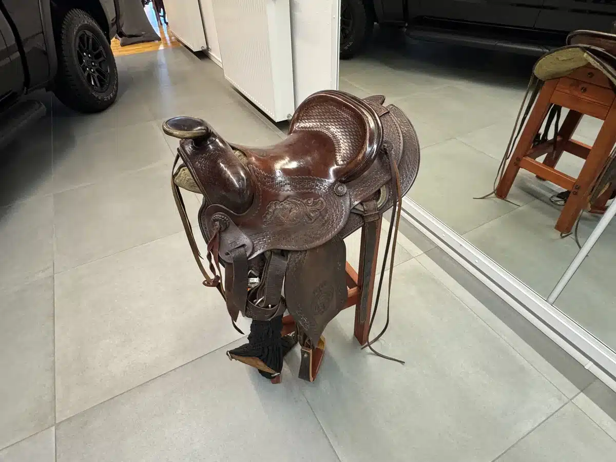 Western saddle on display inside RTR Ram Truck Ranch.