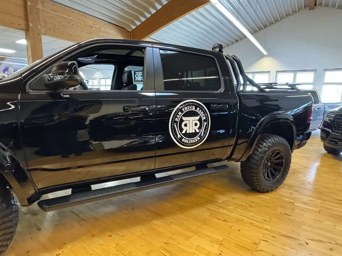 Side view of a Ram pickup with RTR branding on the door.