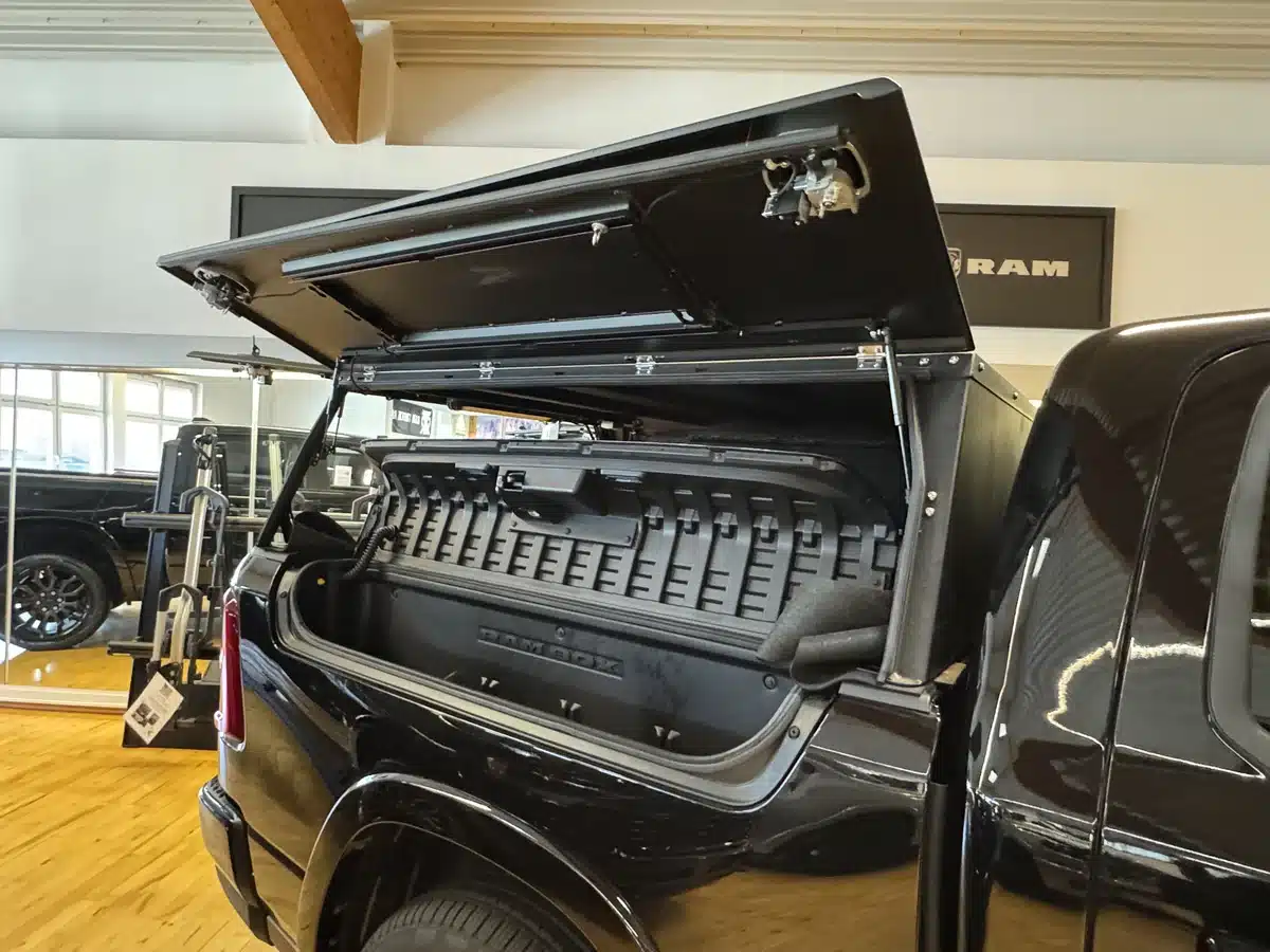 Open side compartment on a pickup bed canopy.
