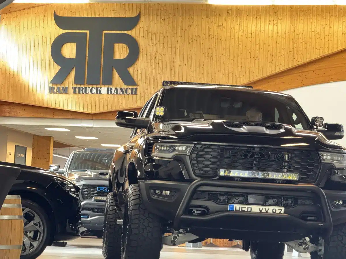 Customized Ram pickup beneath the RTR Ram Truck Ranch logo.