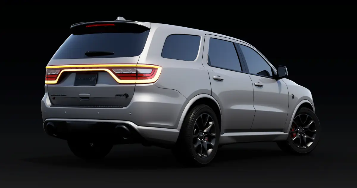 White Dodge Durango with illuminated racetrack taillights, viewed from the rear