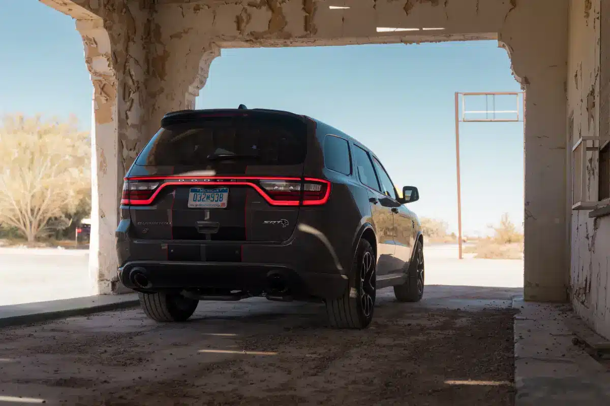 Rear three-quarter view of a dark Dodge Durango with racetrack taillights