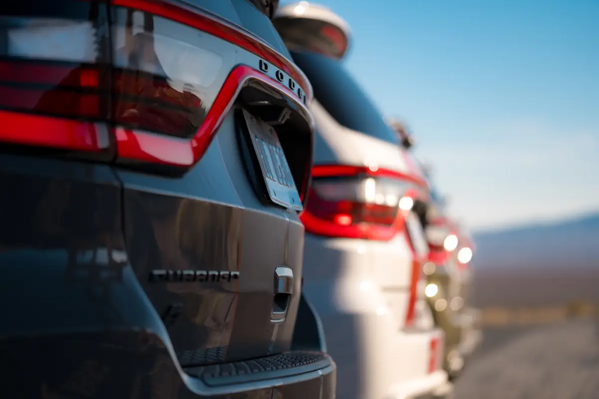 Close-up of the racetrack taillights on a row of Dodge Durango SUVs