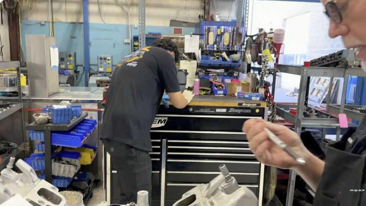 Dave discussing GM 6.2L engine failures at a workshop bench