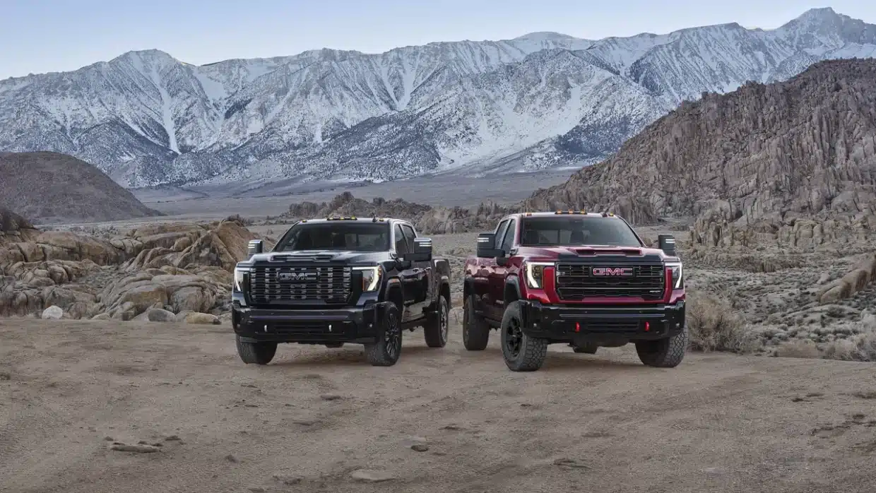 2027 GMC Sierra HD Denali Ultimate and AT4X parked off-road