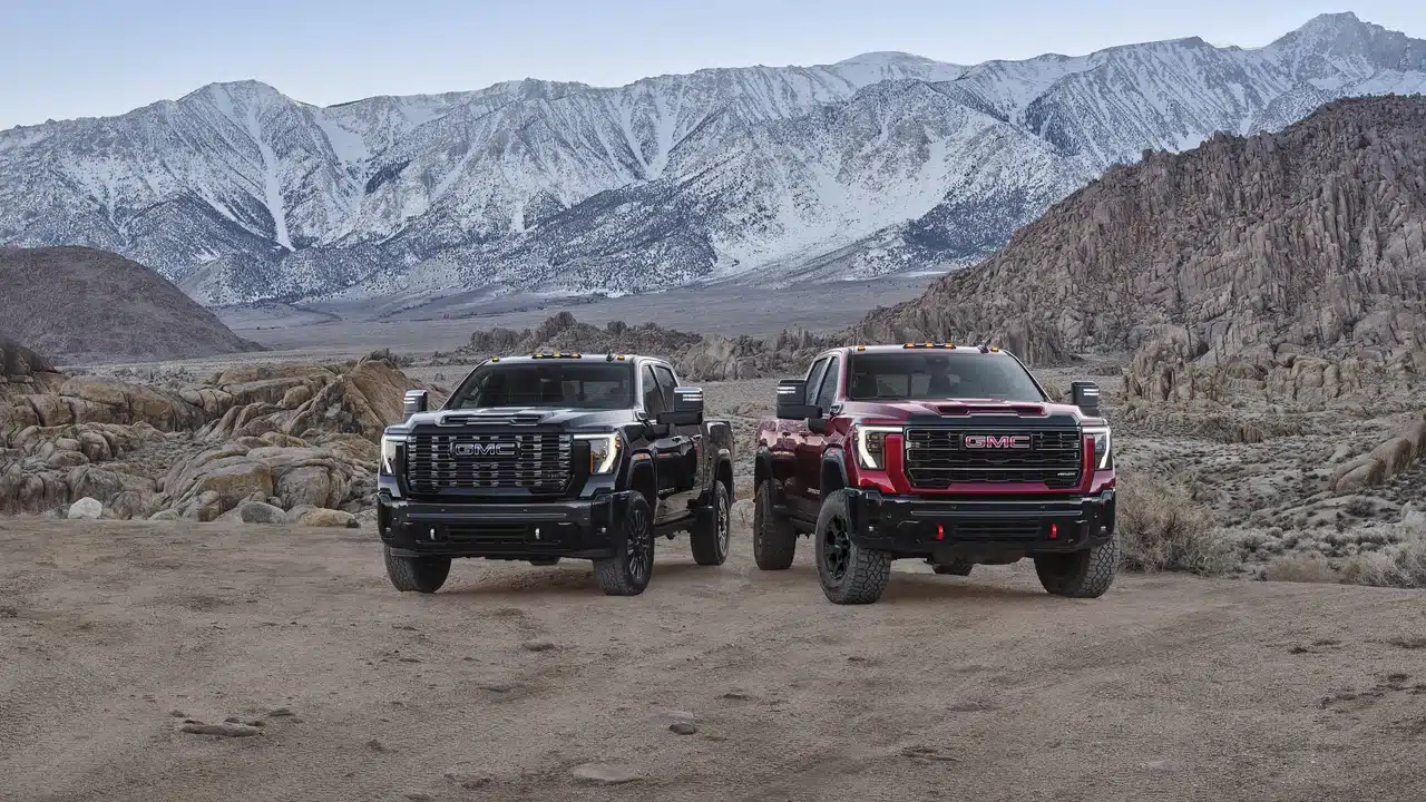 2027 GMC Sierra HD Denali Ultimate and AT4X parked off-road