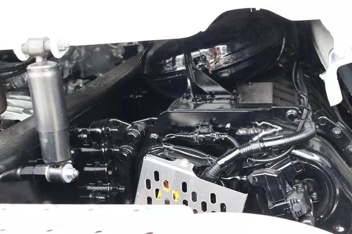 Exhaust aftertreatment mounted beneath a Freightliner Cascadia day cab