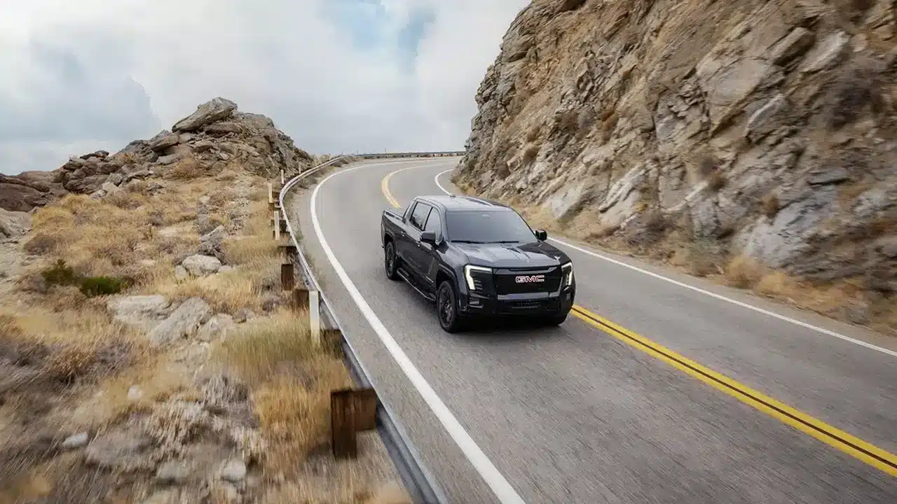 2026 GMC Sierra EV Elevation on a mountain road