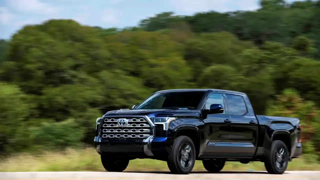 Blue 2022 Toyota Tundra driving on a road